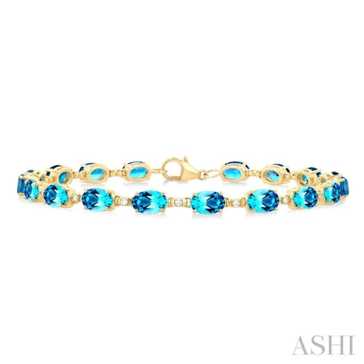 6X4 MM Oval Cut Blue Topaz and 1/6 ctw Round Cut Diamond Semi Precious Tennis Bracelet in 10K Yellow Gold