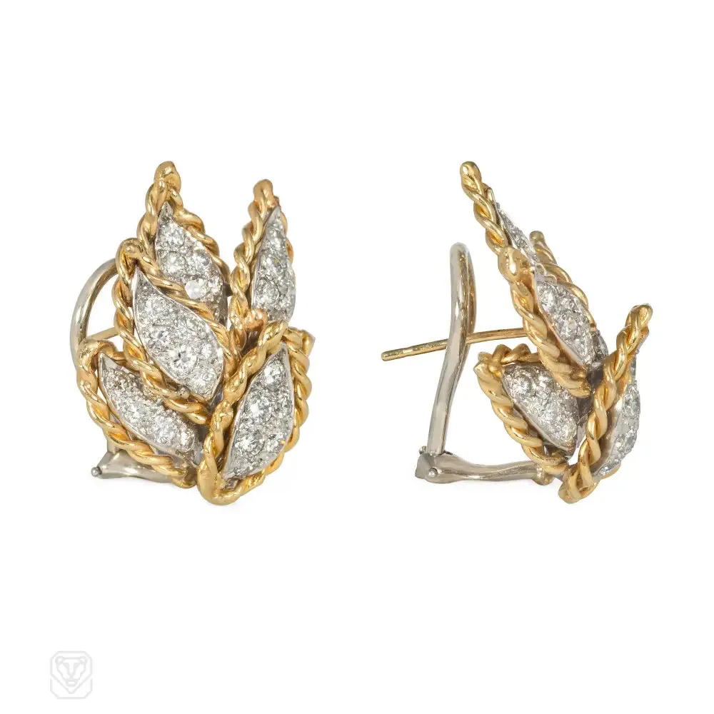 Gold and diamond earrings of overlapping leaf design