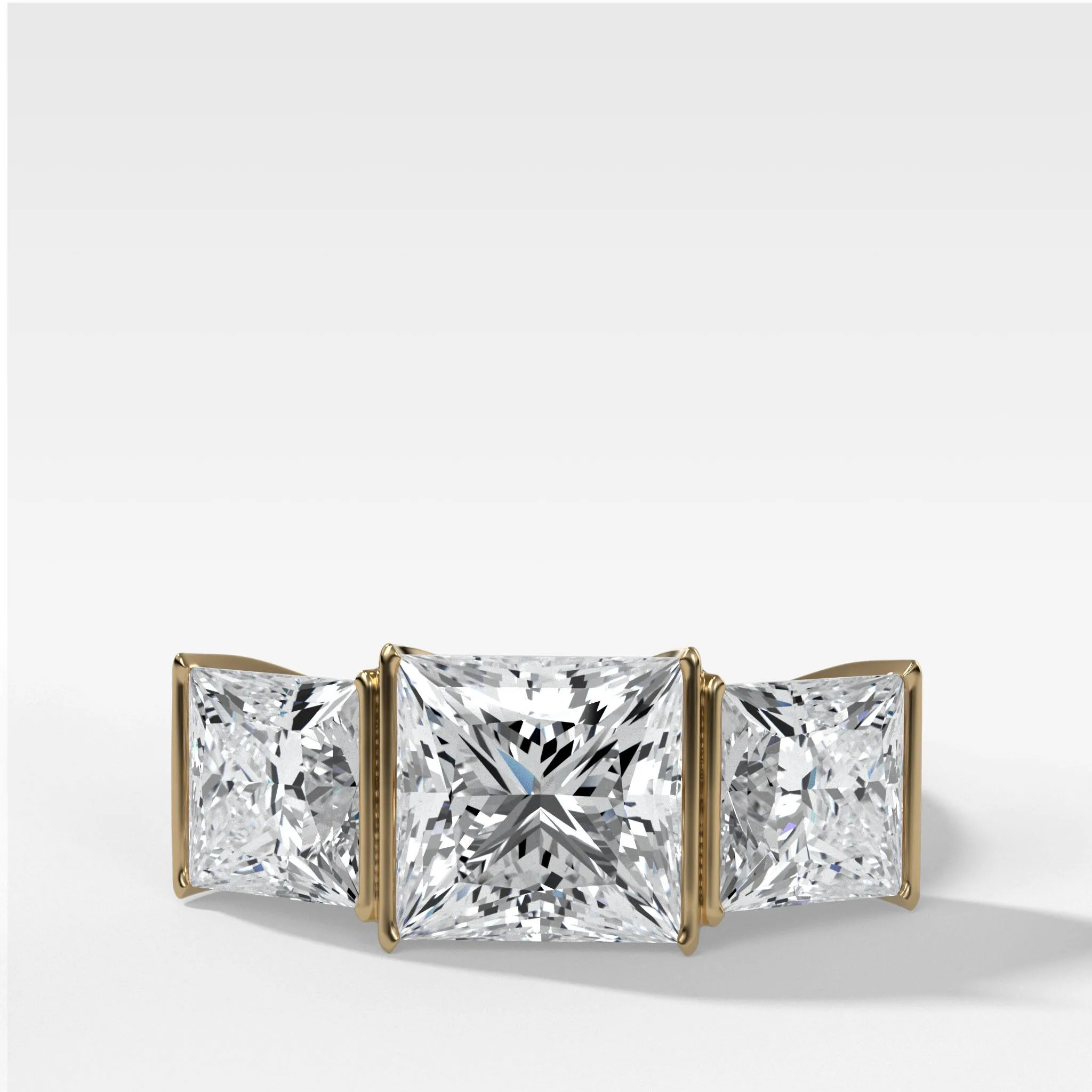 Half Bezel Triad Engagement Ring With Princess Cut Diamonds