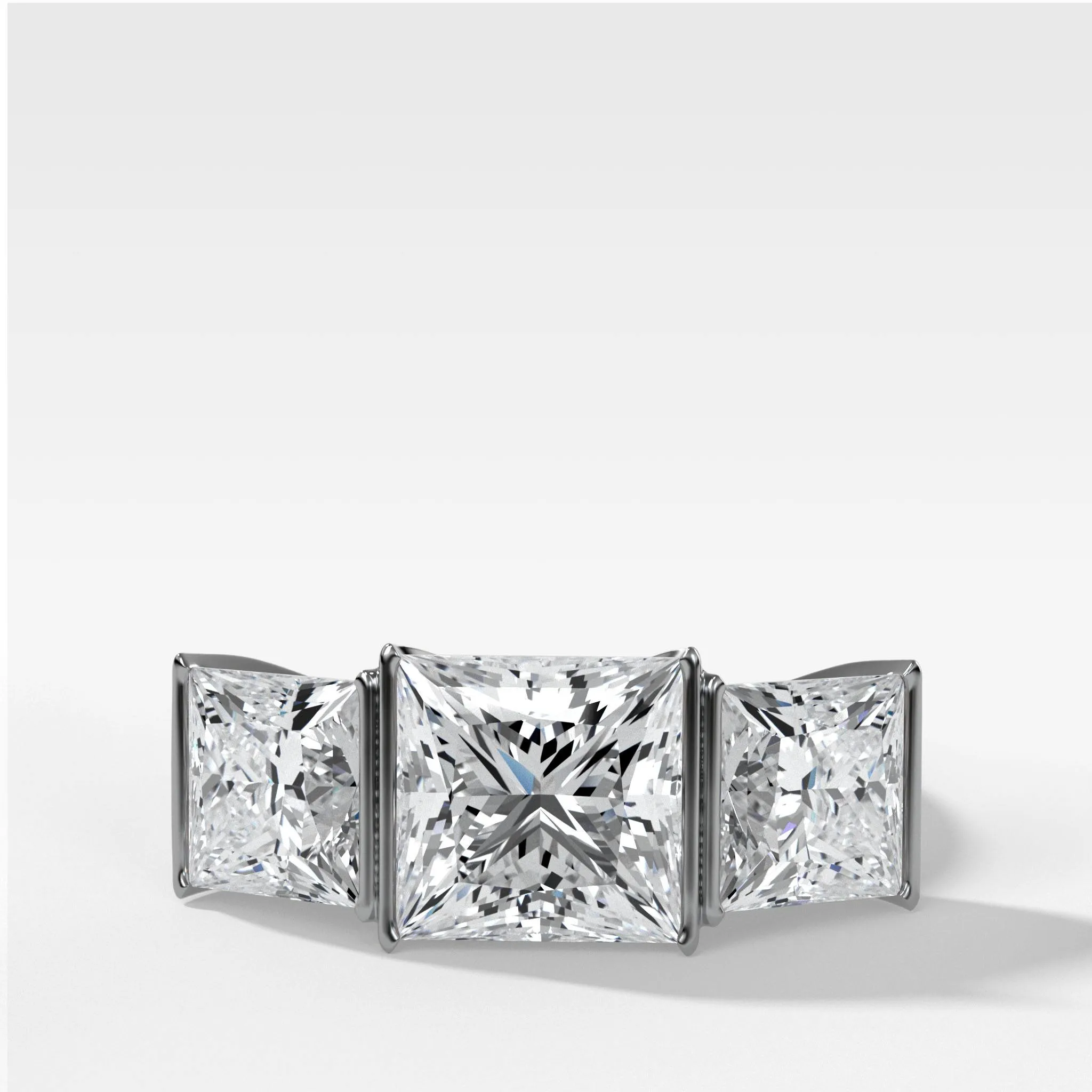Half Bezel Triad Engagement Ring With Princess Cut Diamonds