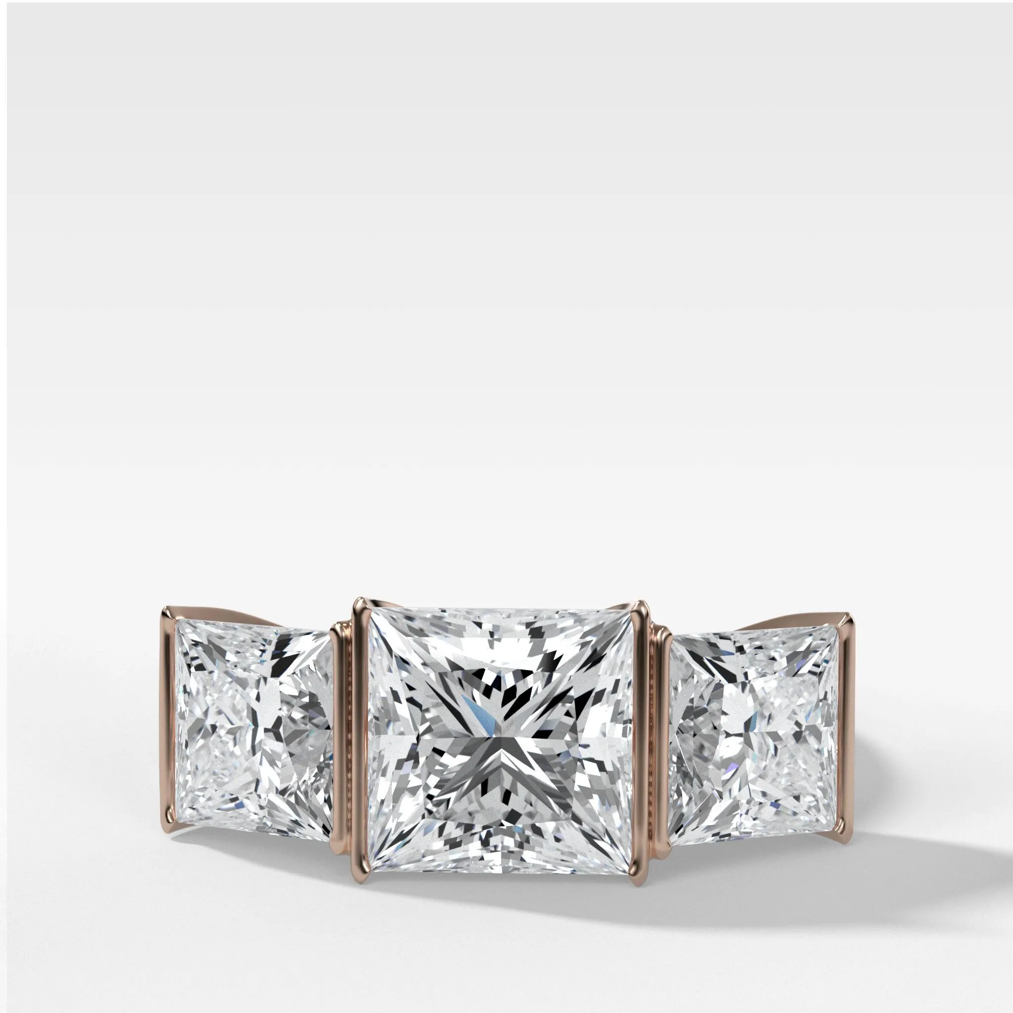 Half Bezel Triad Engagement Ring With Princess Cut Diamonds