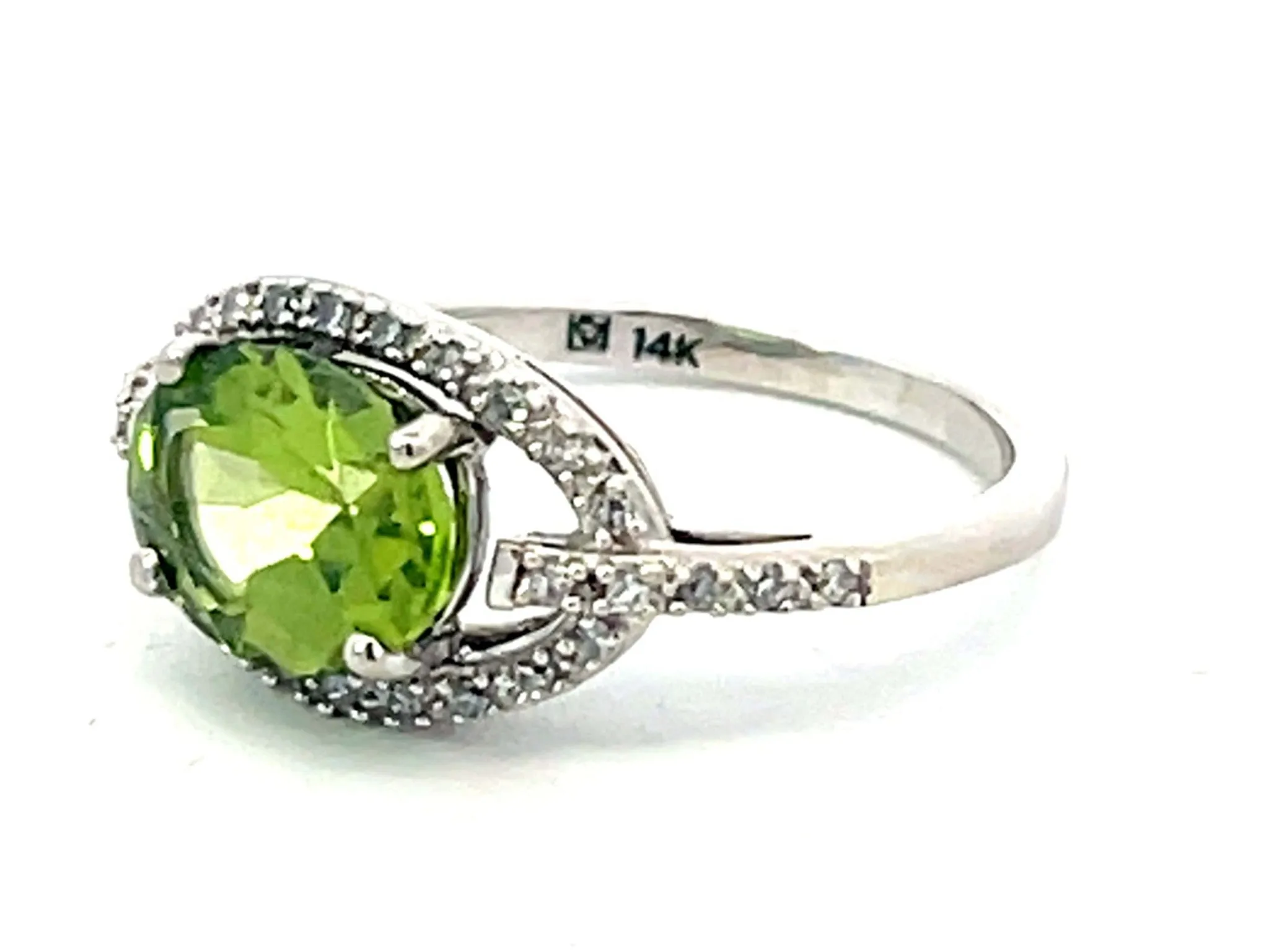 Oval Green Peridot and Diamond Halo Ring in 14k White Gold