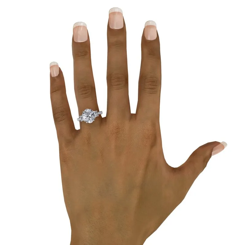 Three Stone Oval and Trapezoid Engagement Ring